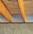 SilverGlo™ insulation installed in a floor joist in Pilot Butte 
