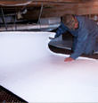 Melville insulation being installed in a crawl space.