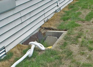 old concrete window well of a Yorkton crawl space