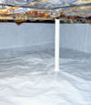 A sealed crawl space in Melville with a vapor barrier