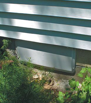 A gray crawl space vent cover in Roblin