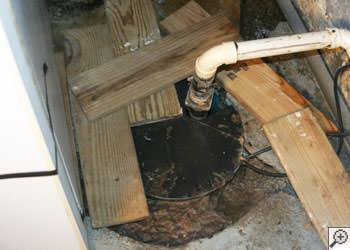 An ugly, clogged sump pump system in Melville, Saskatchewan and Manitoba