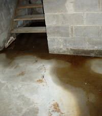 Flooding floor cracks by a hatchway door in Estevan