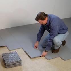 basement subfloor tiles being installed by a contractor in Langenburg