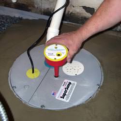 A newly installed sump pump system in a basement in Carlyle