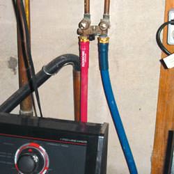 Washer hoses in a basement  in Yorkton