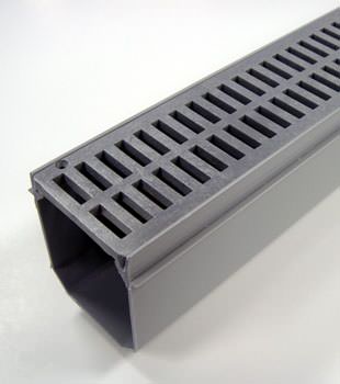 A closeup of our grated basement drainage pipe system, installed in Russell