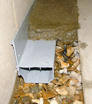 A basement drain system installed in a Melville home
