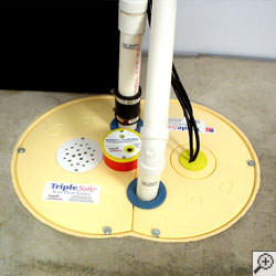 A sump pump system installed along a basement floor in Regina.