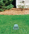 A buried gutter drain downspout extension installed in a Melita home