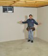 Melville basement insulation covered by EverLast™ wall paneling, with SilverGlo™ insulation underneath