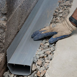 installing a drain tile system in a Carlyle home
